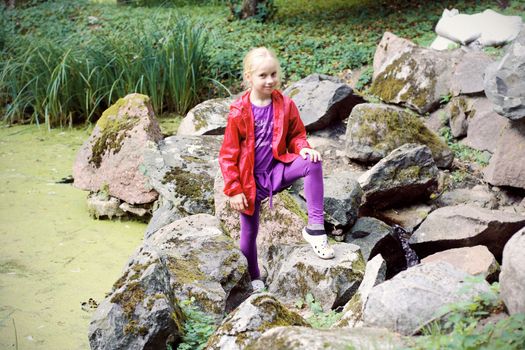 Portrait of Little Girl in Autumn Park