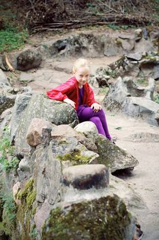 Portrait of Little Girl in Autumn Park