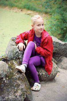 Portrait of Little Girl in Autumn Park