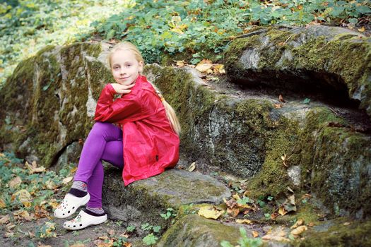 Portrait of Little Girl in Autumn Park