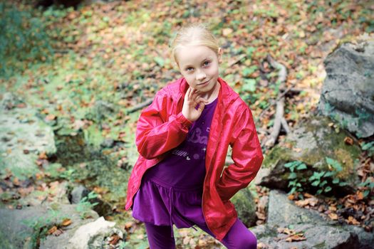 Portrait of Little Girl in Autumn Park