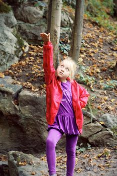 Portrait of Little Girl in Autumn Park