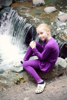 Portrait of Little Girl in Autumn Park