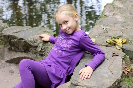 Portrait of Little Girl in Autumn Park