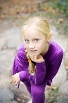 Portrait of Little Girl in Autumn Park