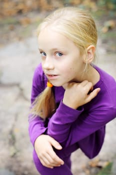 Portrait of Little Girl in Autumn Park