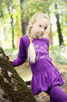 Portrait of Little Girl in Autumn Park