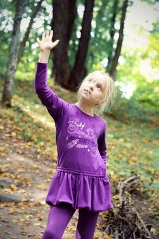 Portrait of Little Girl in Autumn Park