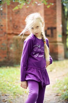 Portrait of Little Girl in Autumn Park