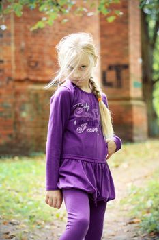 Portrait of Little Girl in Autumn Park