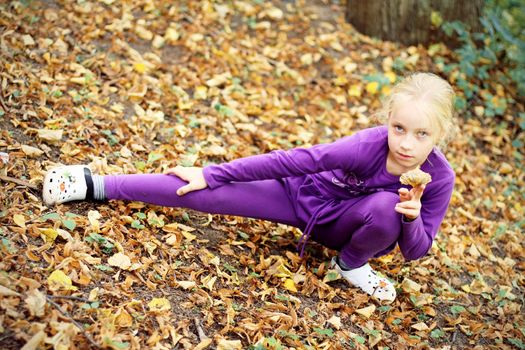 Portrait of Little Girl in Autumn Park