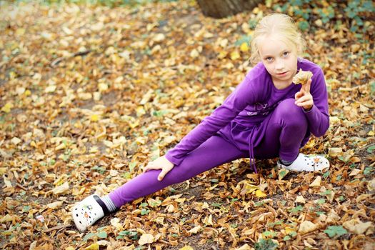 Portrait of Little Girl in Autumn Park