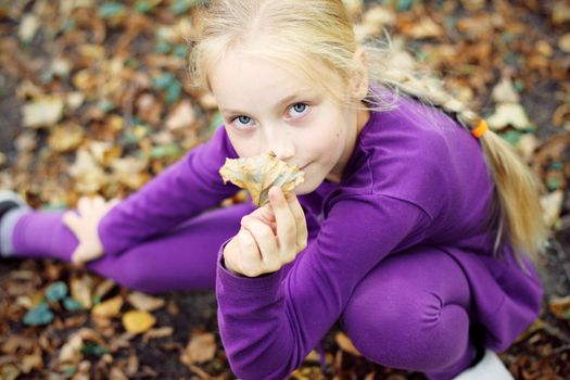 Portrait of Little Girl in Autumn Park