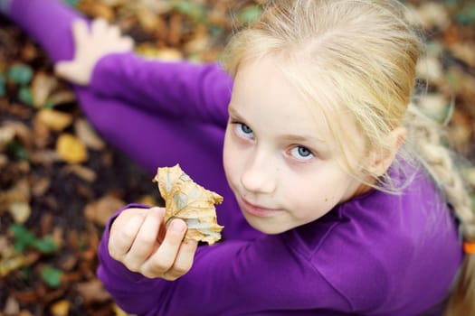 Portrait of Little Girl in Autumn Park