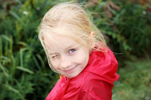 Portrait of Little Girl in Autumn Park