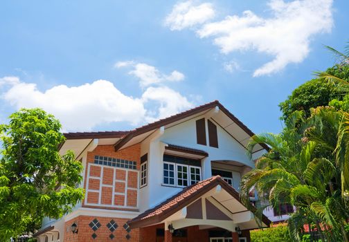 House with tree and blue sky