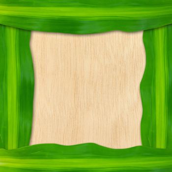 green leaves frame on wood background