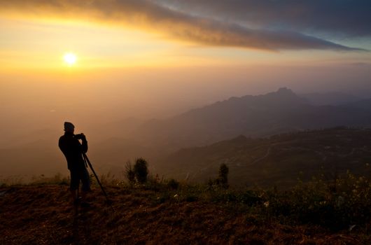 silhouette of photographer on the Mountain