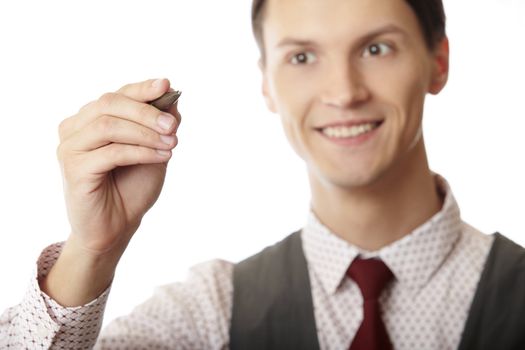 Smiling businessman is writing on a virtual whiteboard. Focus is on the hand and pen