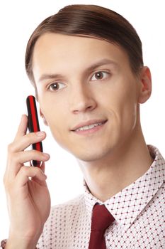 Smilingl businessman talking via cell phone on a white background