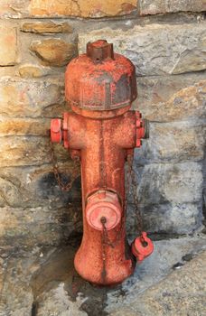 A red fire hydrant in old city