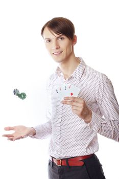 Man holding casino chips and four of aces on a white background