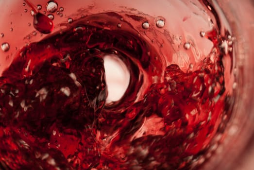 Red drops all over a swirling red whirlpool