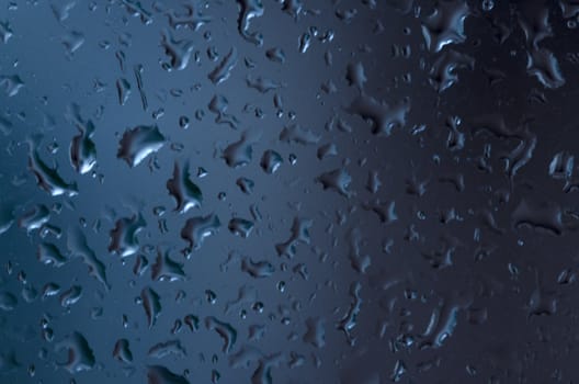 macro picture of rain drops on the window