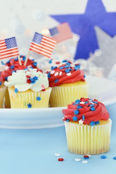 American patriotic themed cupcakes for the 4th of July. Shallow depth of field with selective focus on cupcake in foreground.
