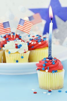 American patriotic themed cupcakes for the 4th of July. Shallow depth of field with selective focus on cupcake in foreground.
