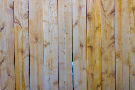 Wood fence with vertical planks - background.