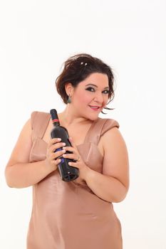 Elegant plus size woman holding a bottle of wine