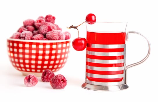 glass juice with chinese cherry apples with frozen raspberries, isolated on white background.