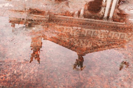 reflection of Lviv Theatre of Opera and Ballet in puddle