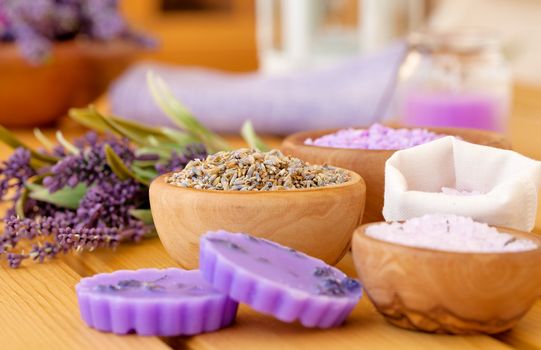 dry Lavender herbs and bath salt, on wooden background