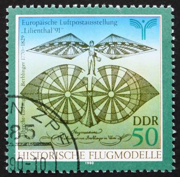GDR - CIRCA 1990: a stamp printed in GDR shows Flying Machine Designed by Albrecht Berblinger, circa 1990