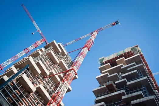 building under construction in a new residential area of Milan