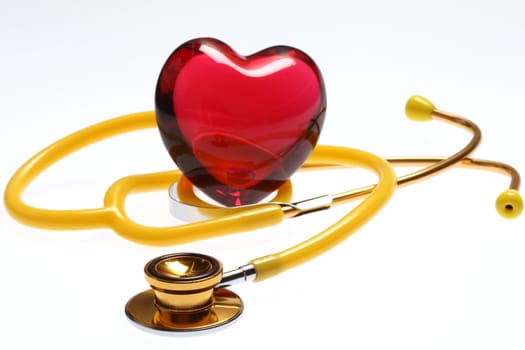 Golden stethoscope with red glass heart
