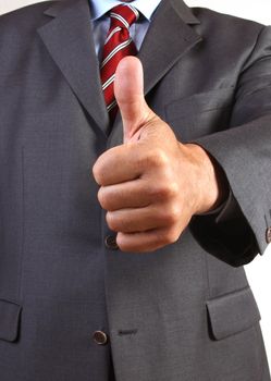 Business man gives a thumbs-up sign