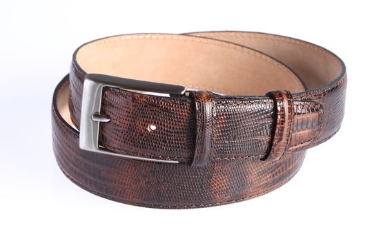 Brown leather belt with crocodile print on white background