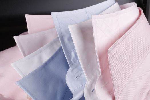 light blue, white and pink business shirt collars