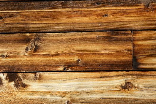 Weathered wood plank of an old cabin, great background and texture, all details visible.