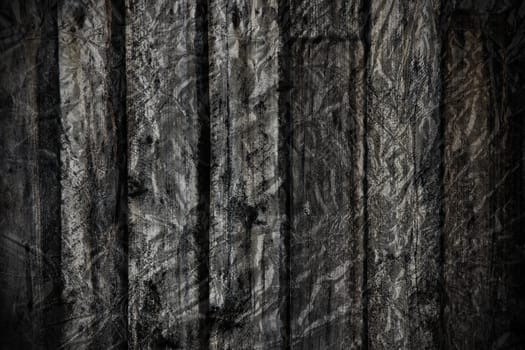 Grungy dramatic black and white old exterior rough wood plank with foil textured applied to create great scary dark background and texture.