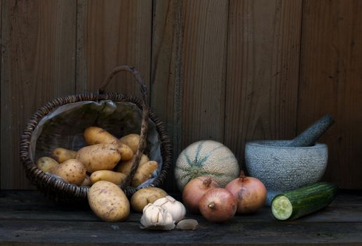 stil life with patatoes onions and others