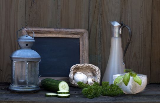 still life with light and school board garlic and cucumber