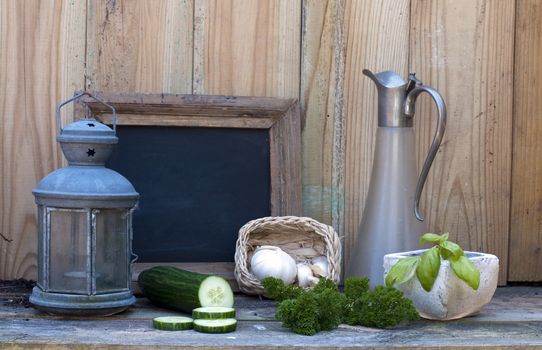 still life with light and school board garlic and cucumber