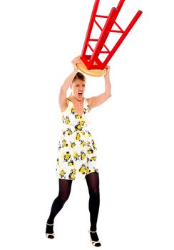 Frustrated woman breaking stool over white background