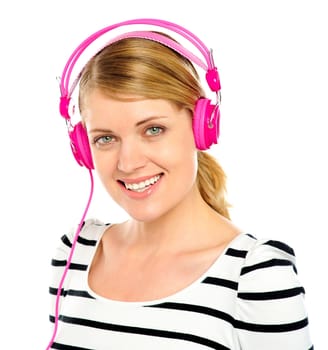 Attractive cheerful caucasian woman listening and enjoying music in headphones