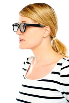 A young beautiful woman wearing sunglasses. Side view