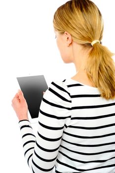 Rear view of teenage girl using touch screen device isolated over white background